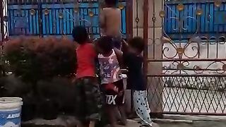 Exciting,.. children climbing areca palm trees