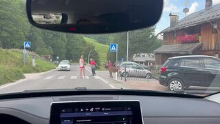 Man coaxes stag through crosswalk