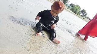 Sach a sweet little baby play with water