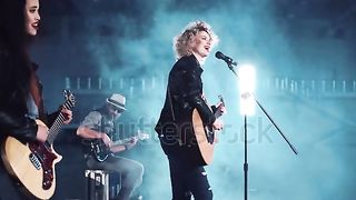 Woman plays guitar well