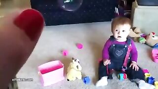 A child playing with a very funny dog