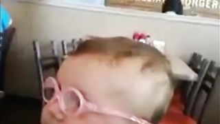 baby wearing glasses for the first time