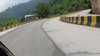 A beautiful view of the Murree Expressway amidst the tall and lush trees of Murree
