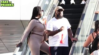 TOUCHING HANDS ON THE ESCALATOR IN FRONT OF GIRLFRIEND
