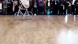 A women biker performs