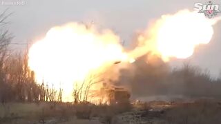 Russian soldiers fire self-propelled Howitzers at Ukrainian battlefield targets