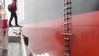 The Most Challenging Task at Sea: Boarding a Moving Ship from a Smaller Boat #ship #adventure #rain #sea #ocean #talent
