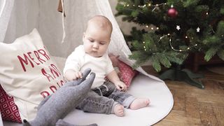 "Love in the Family: Baby's Tender Embrace"