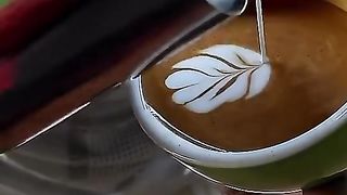 Barista makes coffee with art