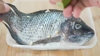 Tilapia fish with yellow sauce