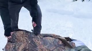 Camping alone on a snowy hill