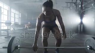 Woman lifting weights 3