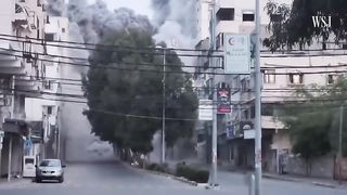 Watch- High-Rise Building in Gaza Crumbles After Israeli Airstrike - WSJ News 0:55