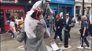 Silver man statue getting up , down and performing in under one minute! (Song by Silverman statue).