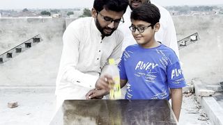 Kid won bicycle by flip bottle