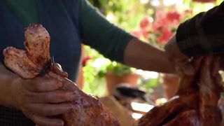 Old Style Cooking Whole Lamb in Underground Tandoor