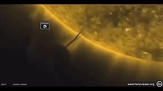 Giant alien spaceship sucking fuel from the sun?