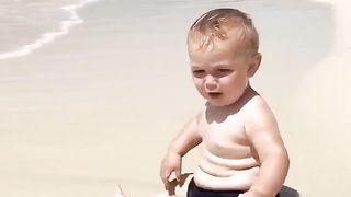 Funny baby reaction on the beach 5