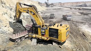 Huge Caterpillar 6015B Excavator Loading Trucks
