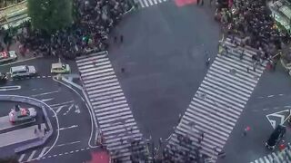 Shibuya Crossing is a scramble junction located northwest of Shibuya Station