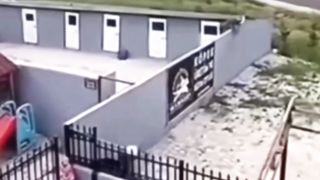 A dog is running after a man.