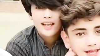 Cute boys enjoying song