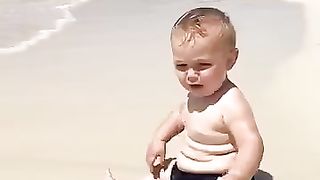 Funny baby reaction on the beach 6