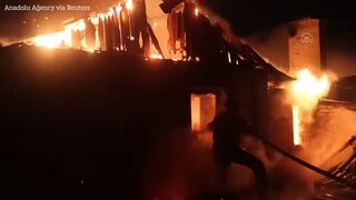 Massive flames burn through Ukrainian village after Russian strike