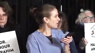 a British doctor is overcome with emotion while reading an urgent message from the director of Al-Shifa Hospital in Gaza