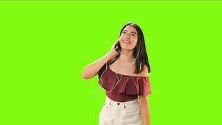 Girl dancing with her earphones on a green background