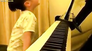 Piano playing by a four years old boy