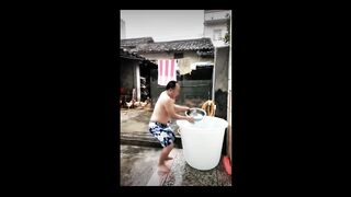 Funny video of a man taking a bath afraid of getting hit by water