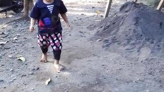 beautiful girl playing in the sand