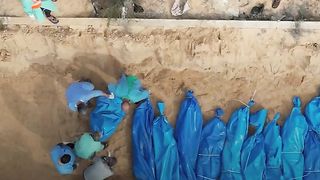 A number of GAZAN  martyrs were buried in a mass grave in Khan Yunis
