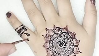 Little princess thanks her mom for beautiful henna design