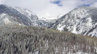flying-into-snowy-mountains-4k