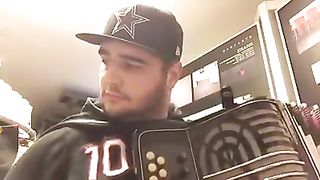 Jonathan Galvão playing on an old concertina.