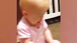 Baby plays with big brother and sister