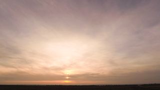 "The Final Brushstroke: Painting the Sky at Sunset"