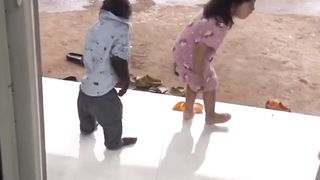 The monkey forbade this child from playing in the rain