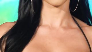 MODEL AMBER QUINN shows off her talents on the bik