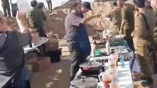In Gaza, the Israeli army is preparing food and firing shells at the same time.