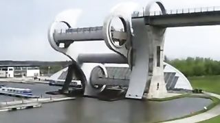 The Falkirk Wheel in Scotland, is a rotating boat lift that links the Forth and Clyde Canal to the Union Canal.