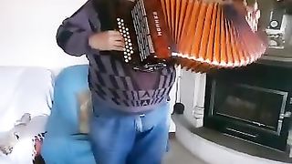 Me in my house playing the concertina.