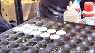 London Street Food. Cooking Sweet Dutch Pancakes "poffertjes" in Camden Lock Market