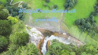 Waterfall rocks Montain with green valley