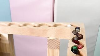 File name Wooden track ball and stone balls rolling down the mountain to compete for first place. Educational. Upload