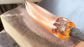 Sylcom Master of Glass shaping a gold leaf.