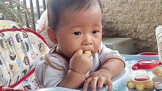 Baby for the first time enjoy snack