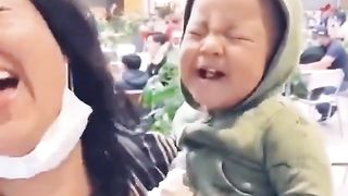 Baby eating ice cream for the first time.